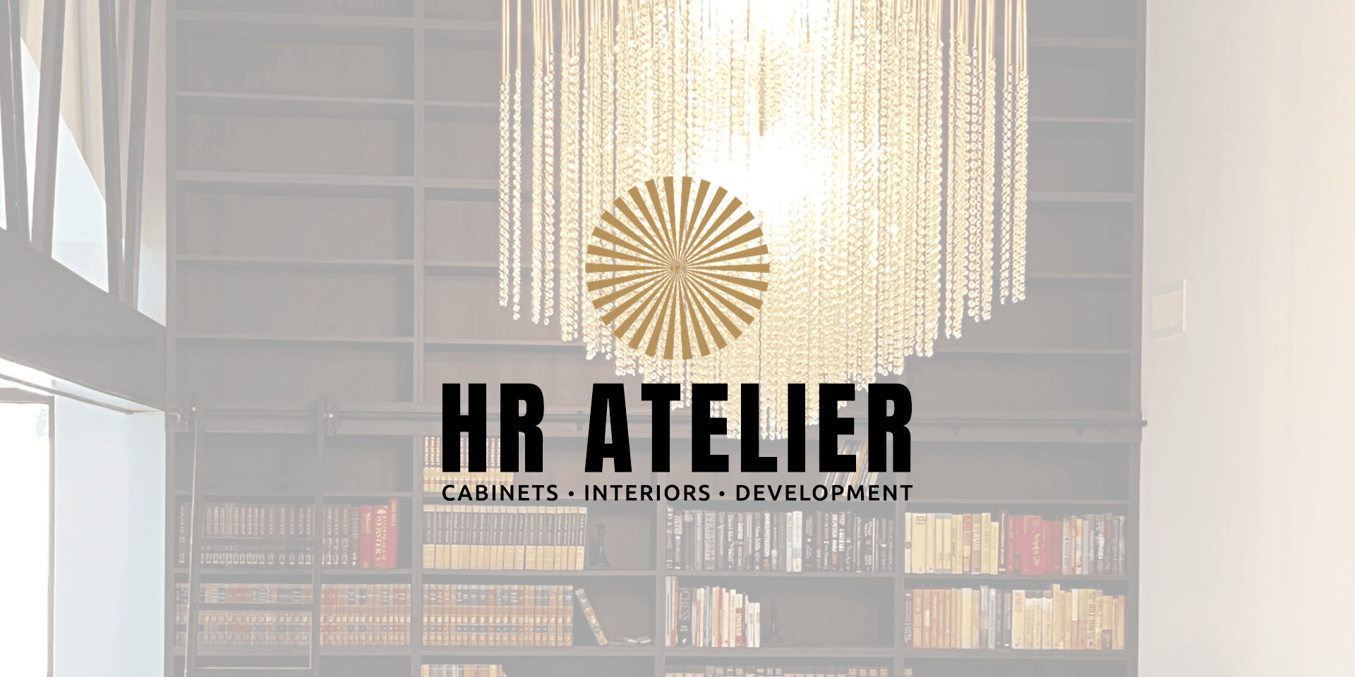 Chandelier over library with HR Atelier logo